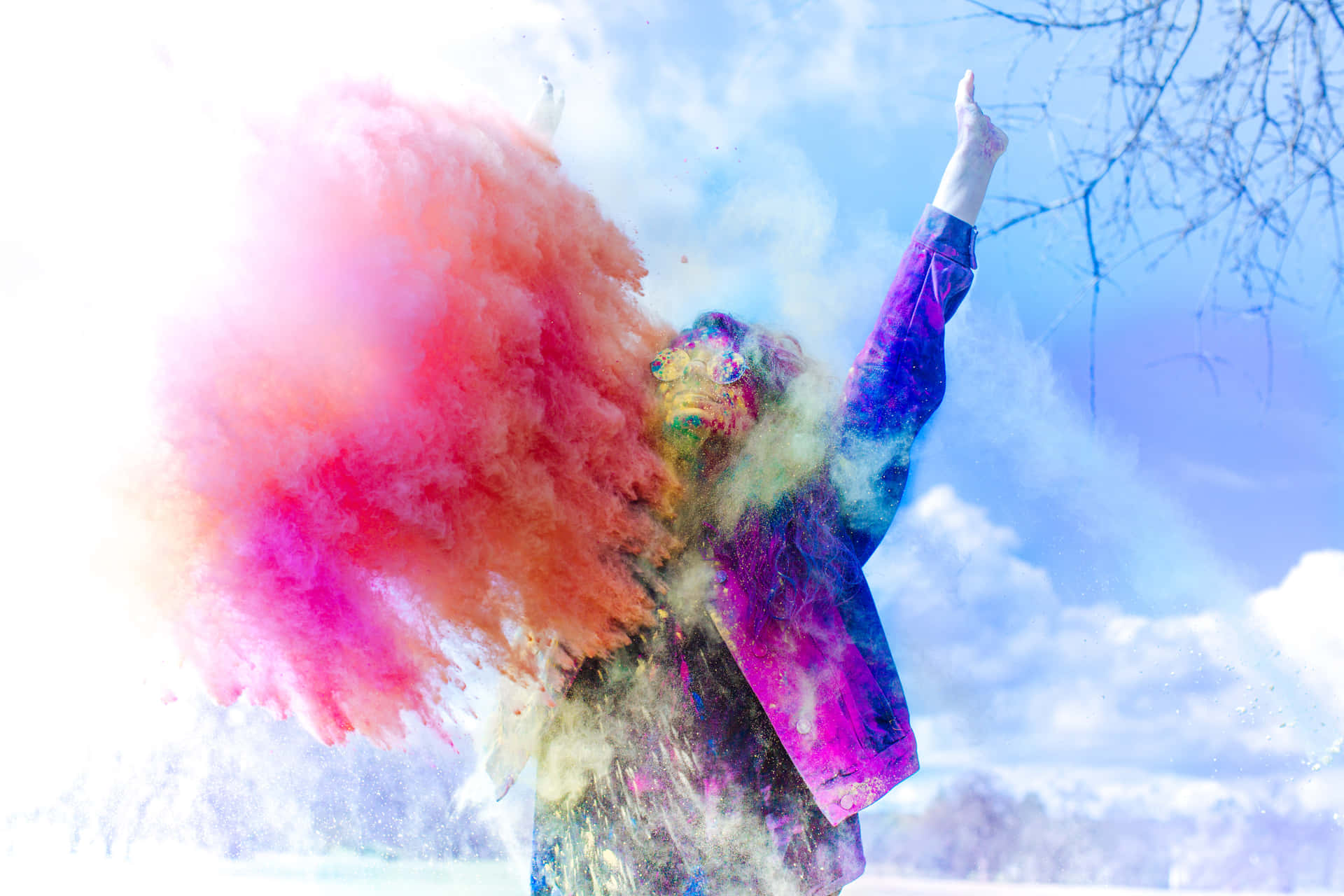 A Woman Is Throwing Colored Powder