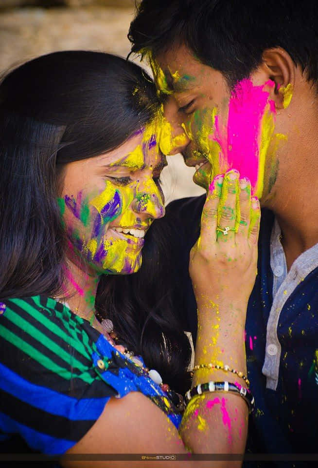 Holi Couple In A Colorful Pose
