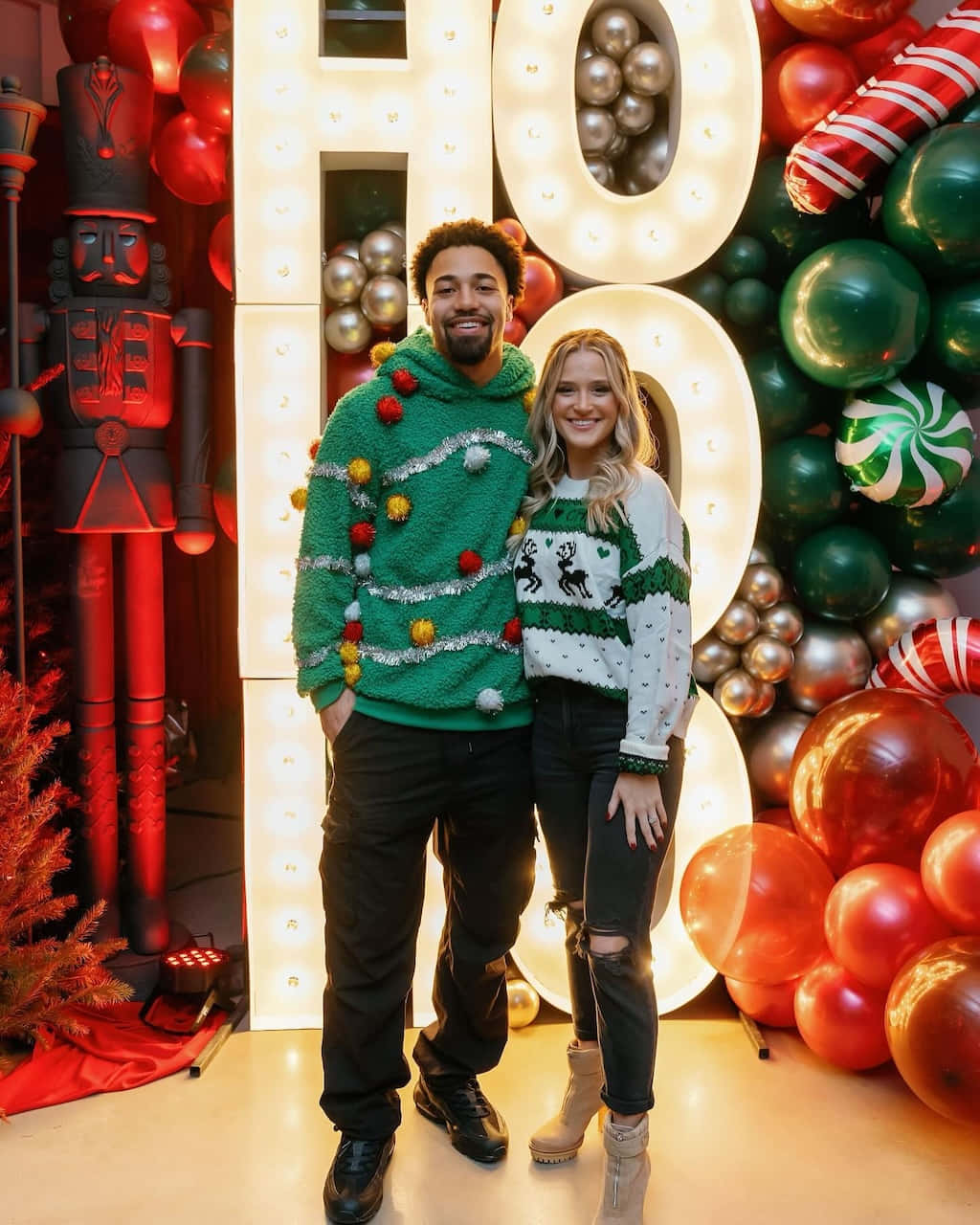 Holiday Couplein Ugly Christmas Sweaters Wallpaper