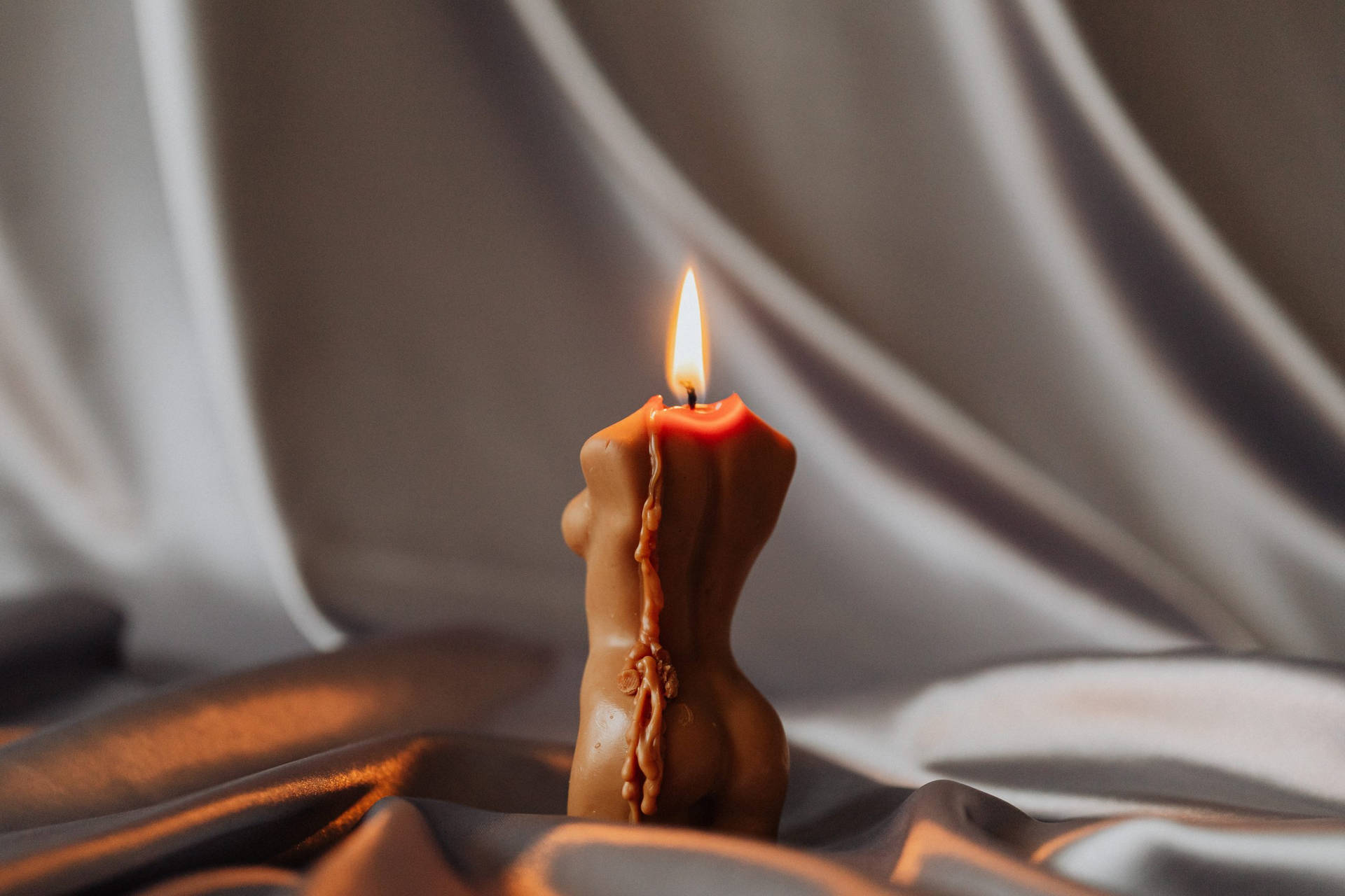 Holistic Lit Woman-shaped Candle Wallpaper