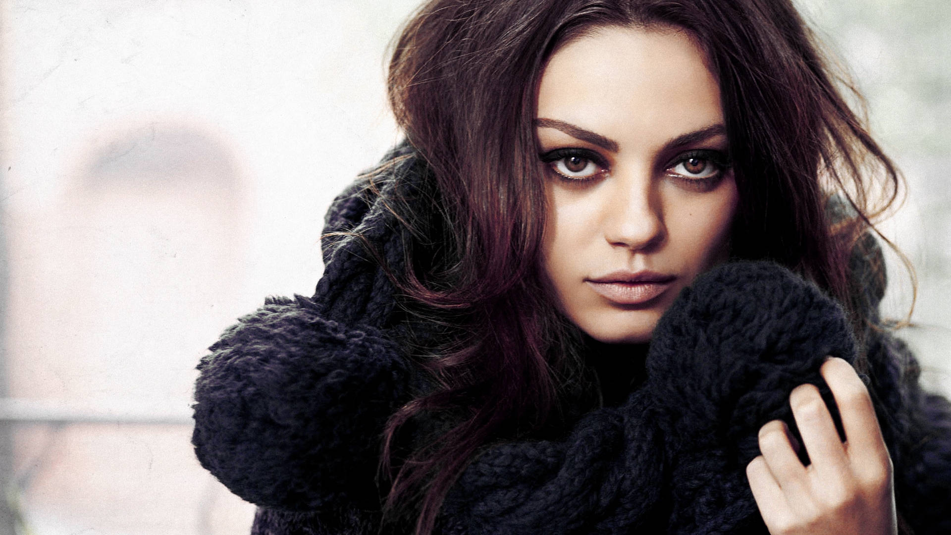 Mila Kunis: Hollywood’s Enigmatic Beauty Wallpaper
