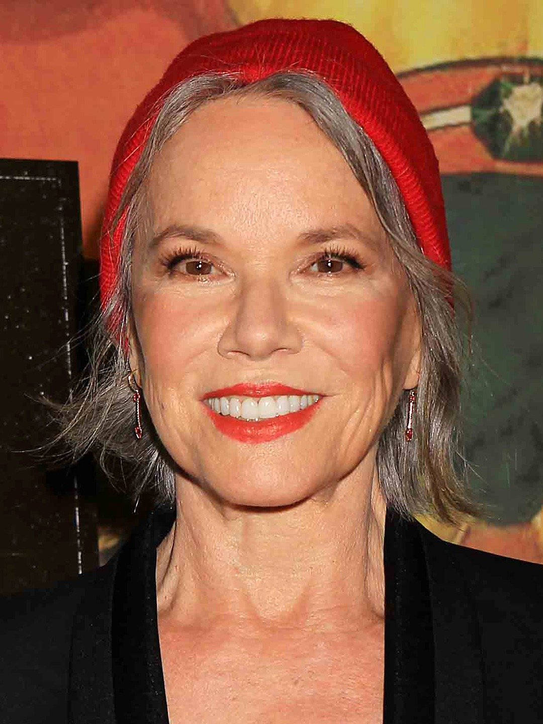 Hollywood Star Barbara Hershey With A Red Beanie Wallpaper