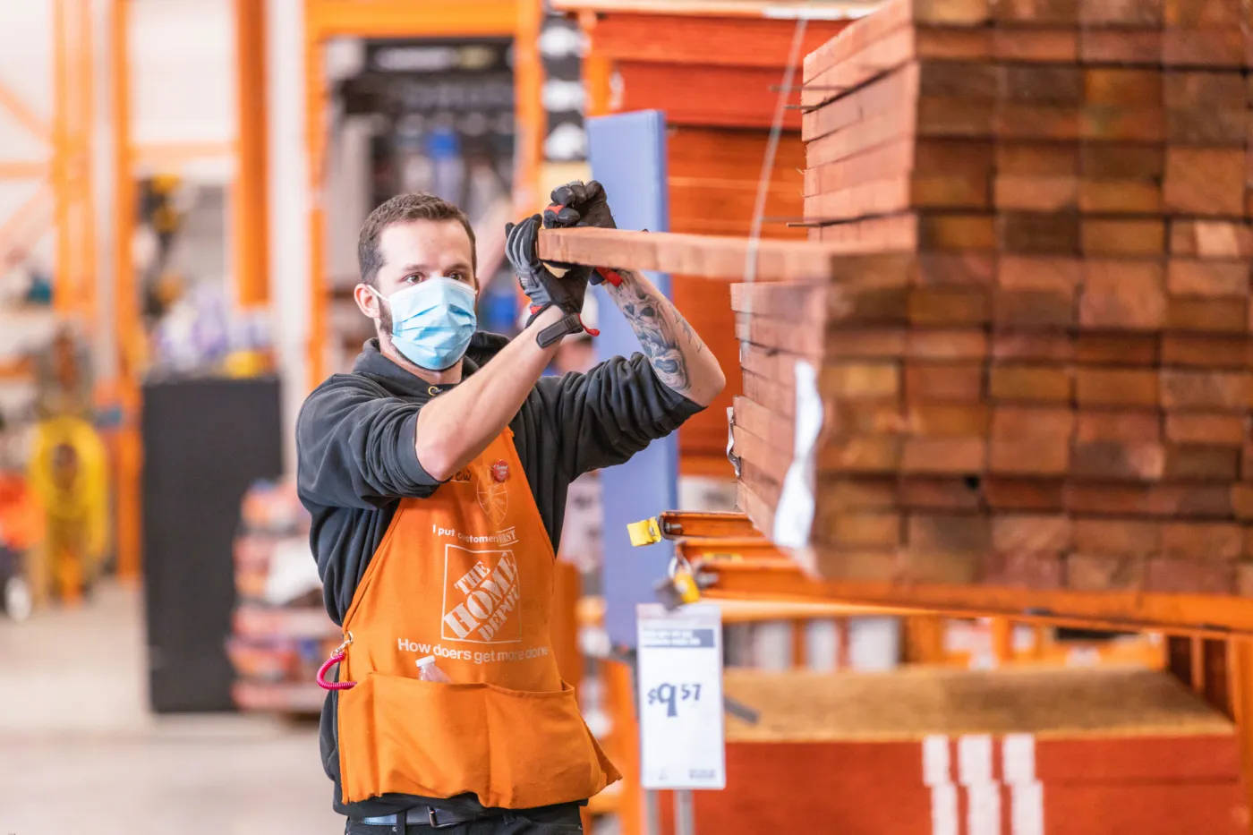 Reliable Home Depot Employee Serving Shoppers Wallpaper