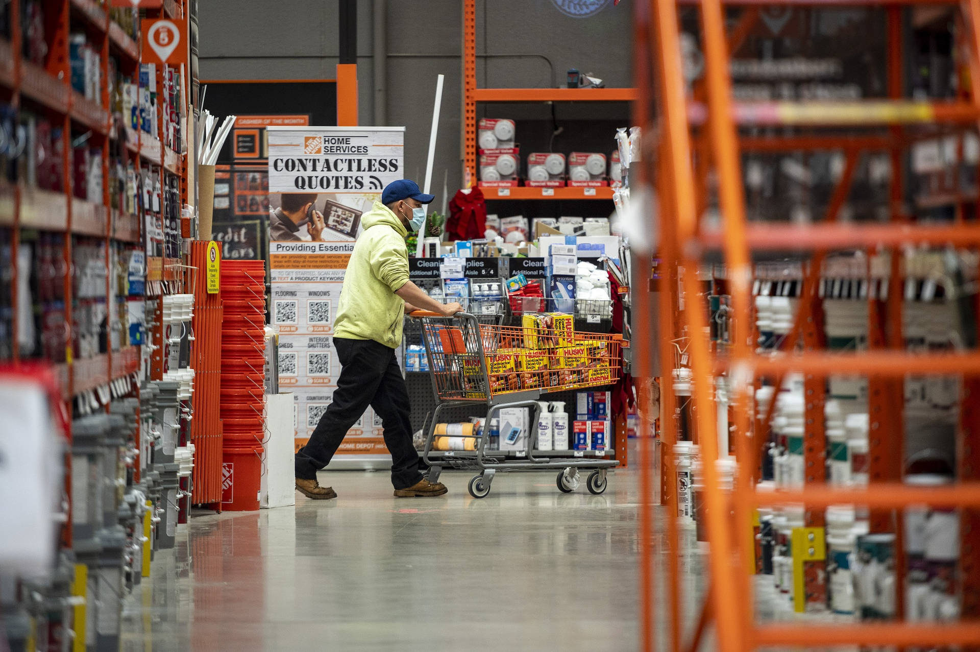 Shopper Perusing Aisles at Home Depot During Pandemic Wallpaper