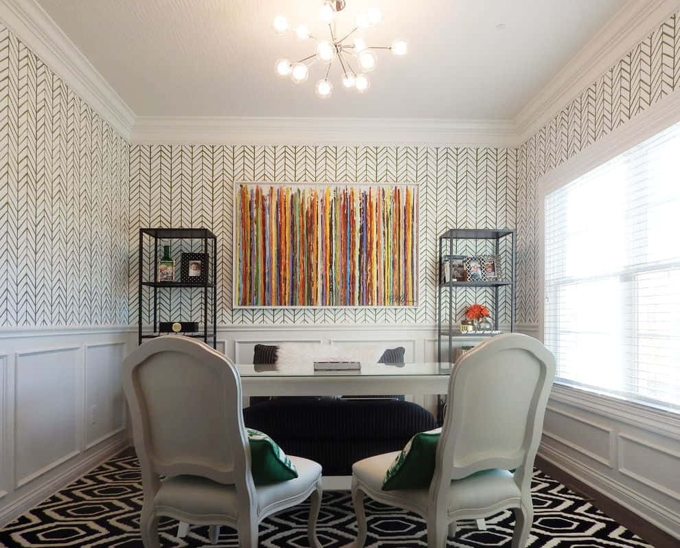 A Home Office With A Black And White Rug And Chairs Wallpaper