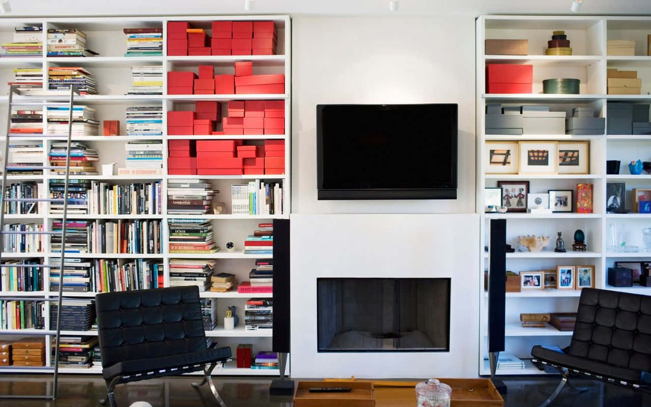A Living Room With A Fireplace And Bookshelves Wallpaper