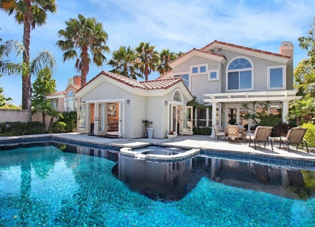 A Large Home With A Pool And Patio
