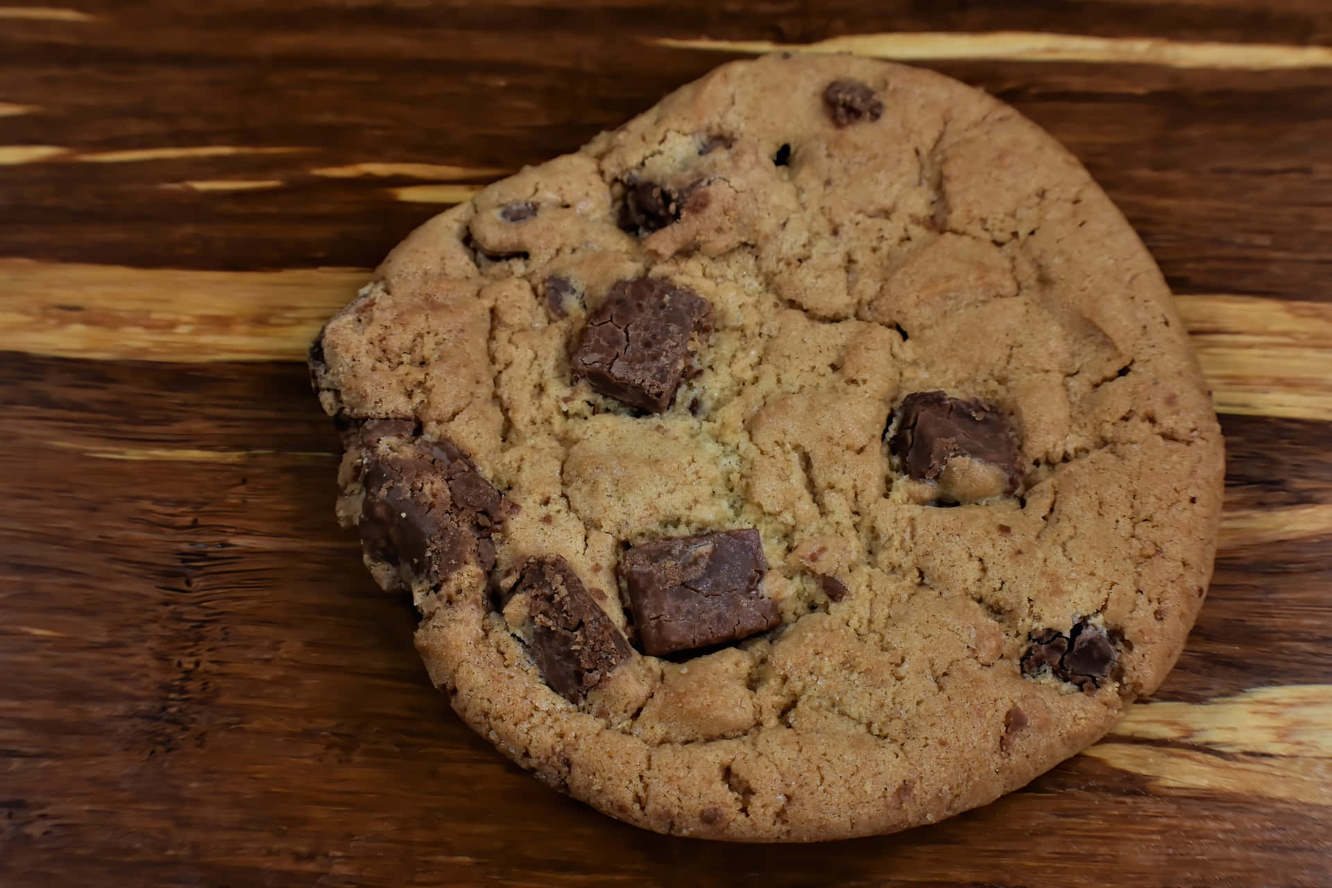 Homemade Chocolate Chip Cookie Wooden Background.jpg Wallpaper