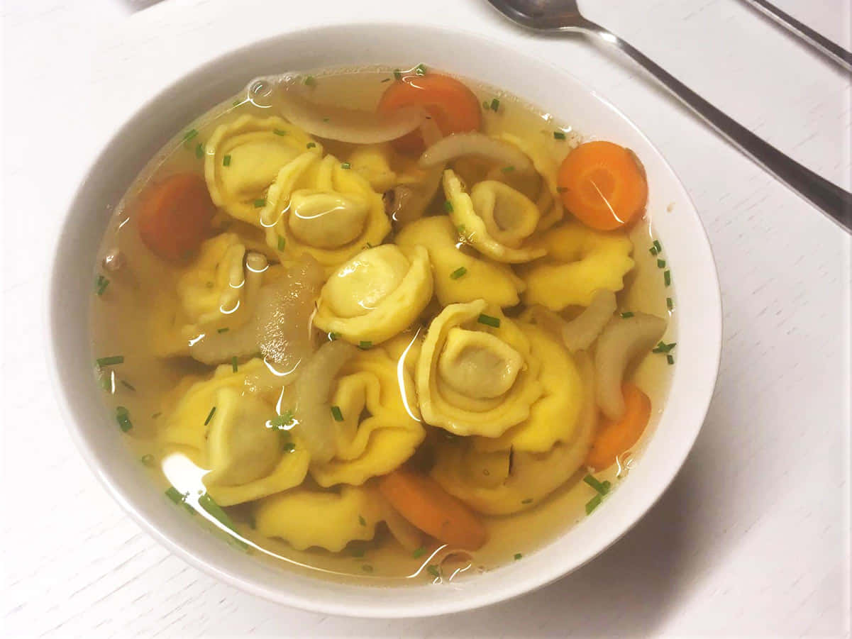 Homemade Tortellini In Brodo With Carrots Wallpaper