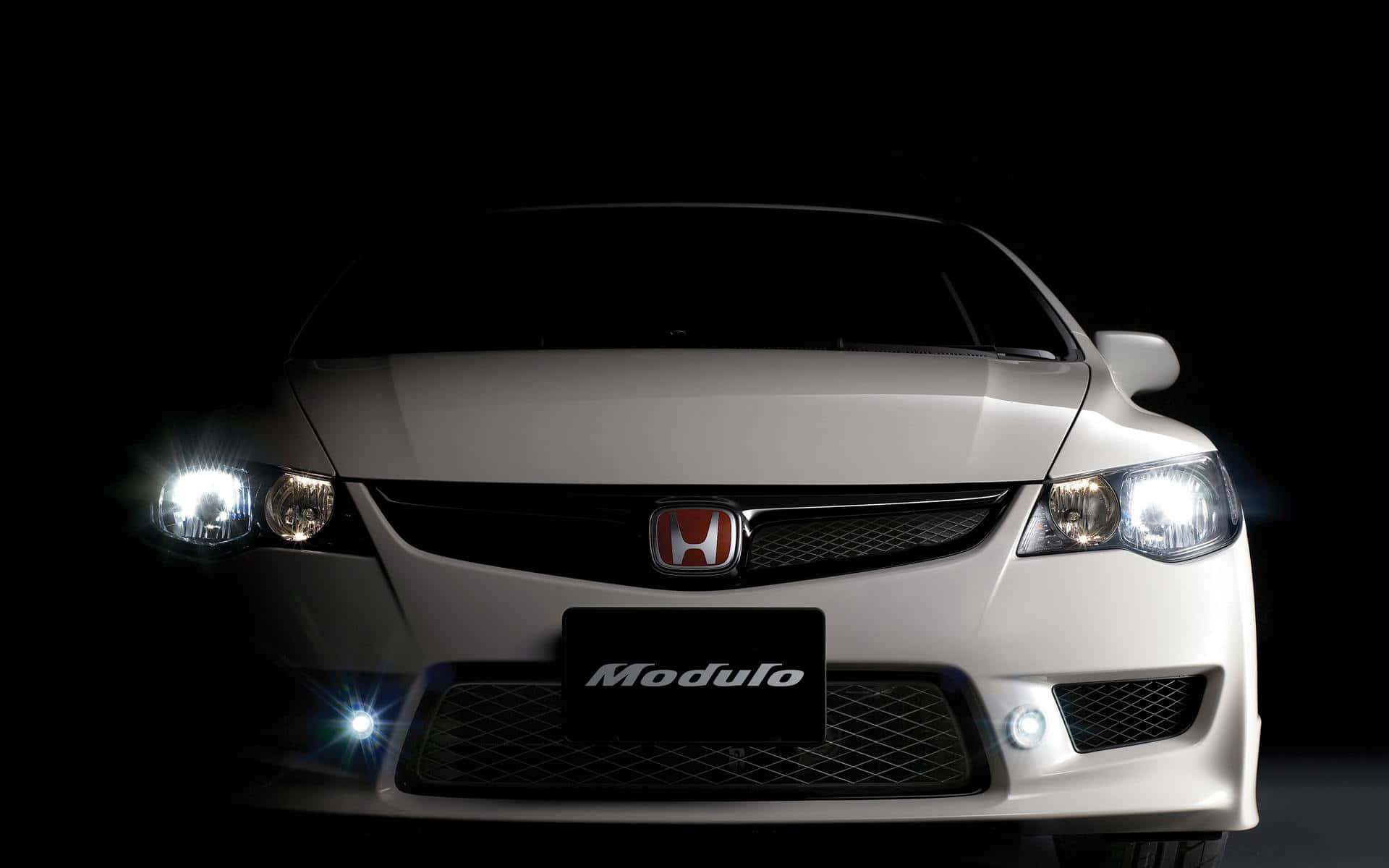 The iconic Honda logo on a sleek black background