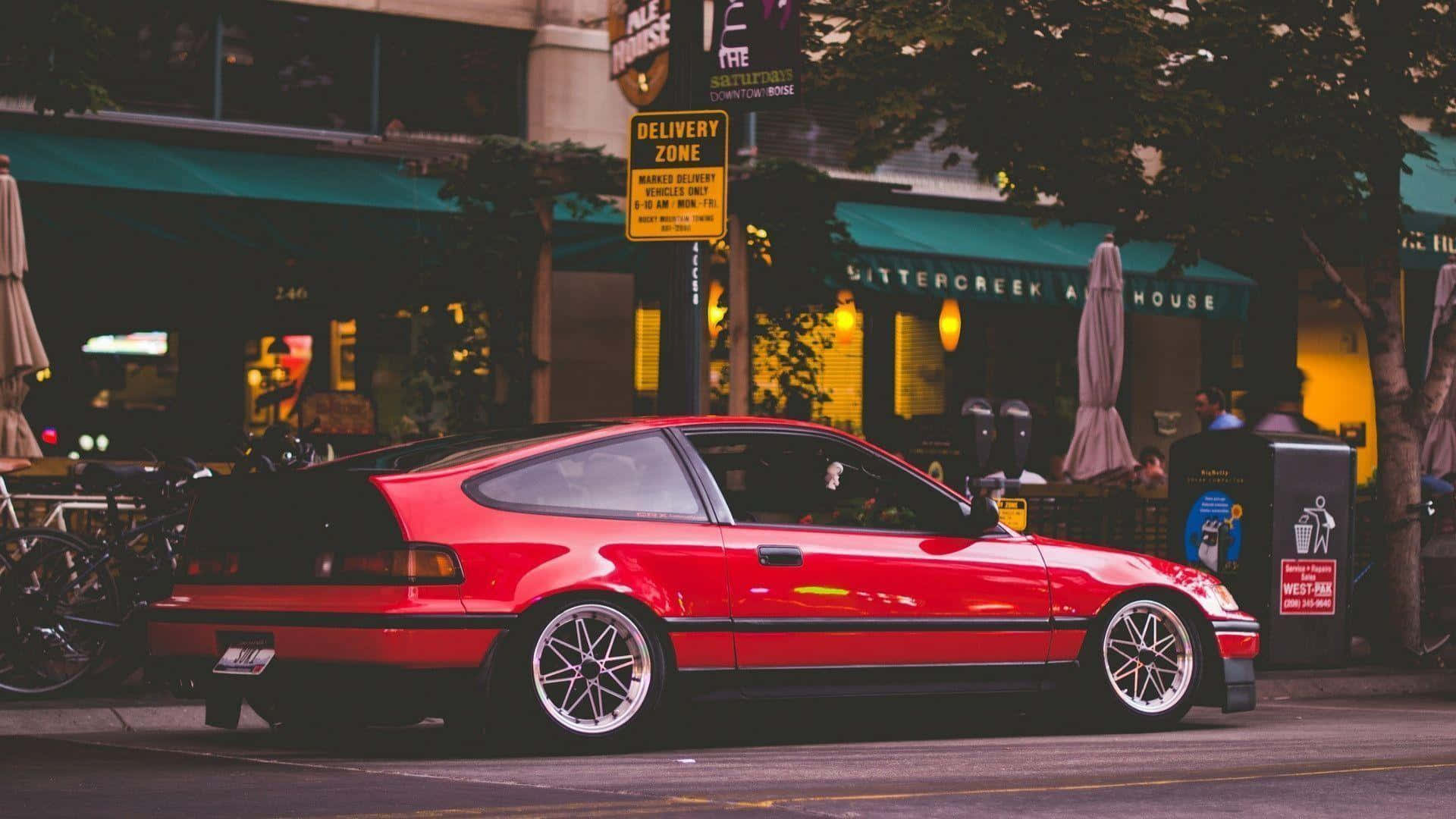 Sleek Red Honda Civic Del Sol On City Street Wallpaper