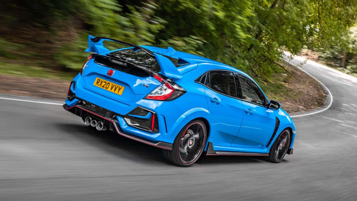 The Blue Honda Civic Type R Driving Down A Winding Road Wallpaper