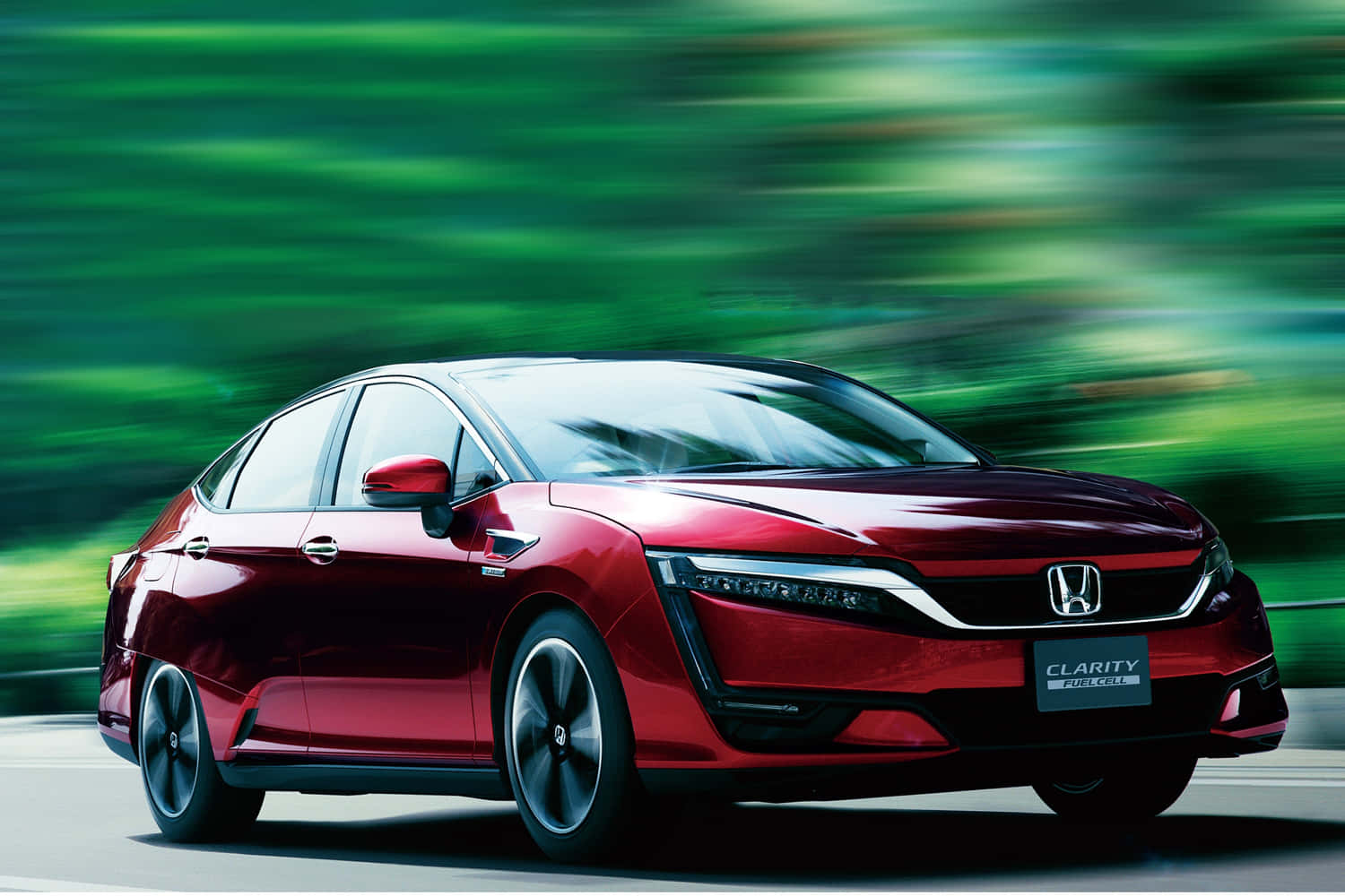Sleek Honda Clarity parked outdoors in style Wallpaper