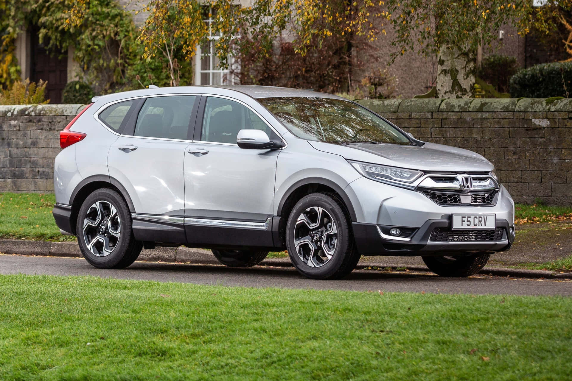 Sleek and Stylish Honda CR-V on a Picturesque Road Wallpaper