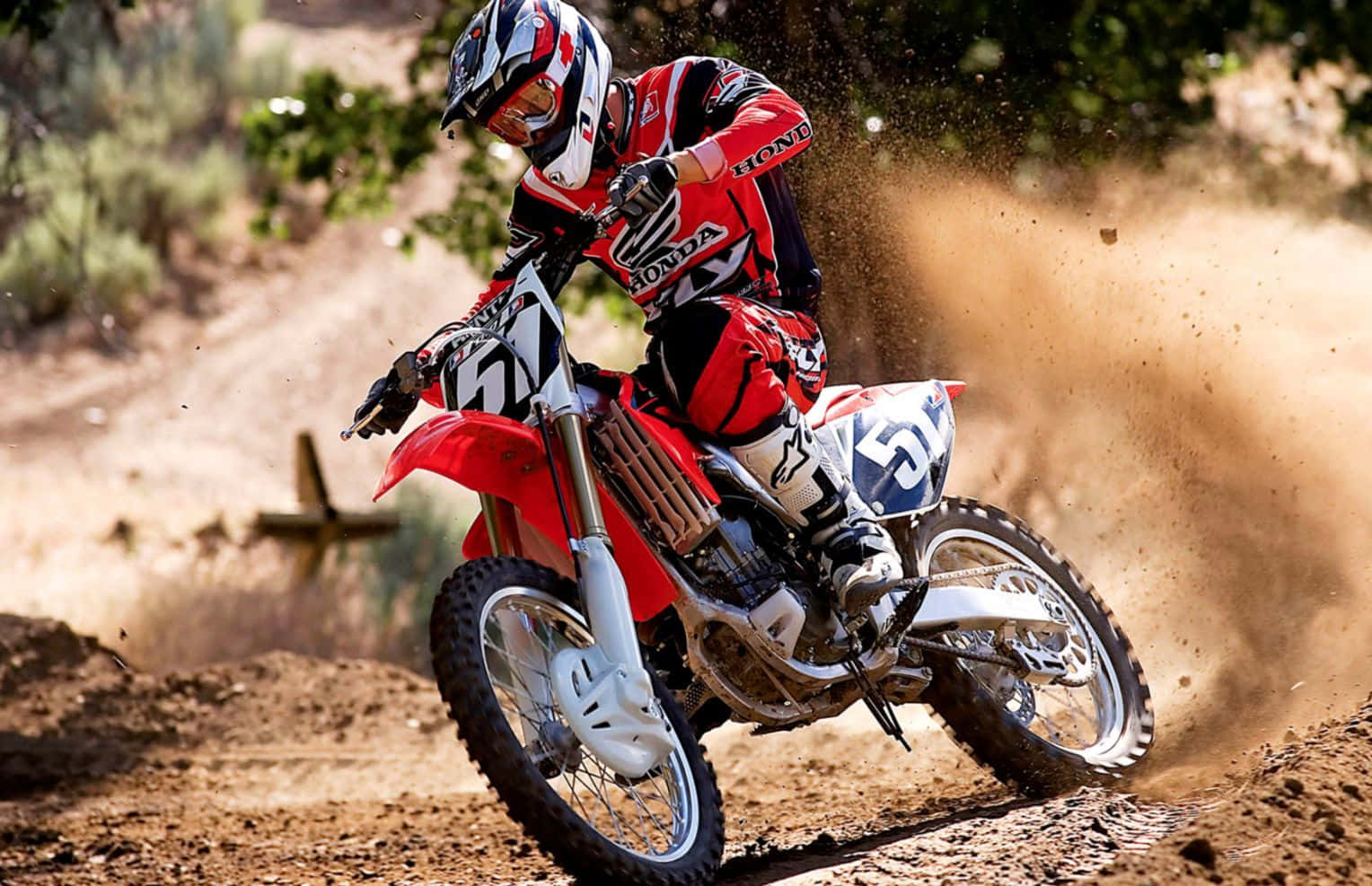 Unleash your inner passion and explore the trails using a Honda Dirt Bike. Wallpaper