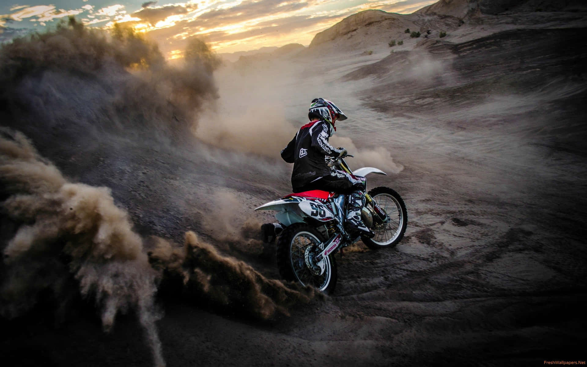 "Ready to Tear Up the Trails: A Honda Dirt Bike" Wallpaper