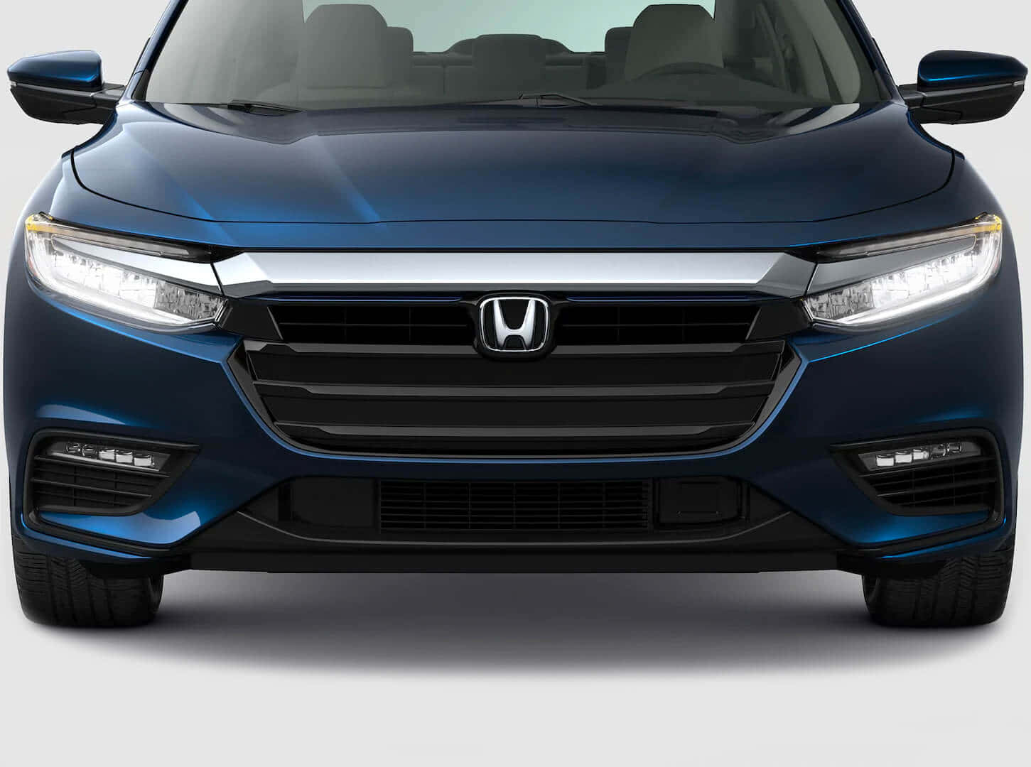 Sleek Honda Insight Hybrid on the Road Wallpaper