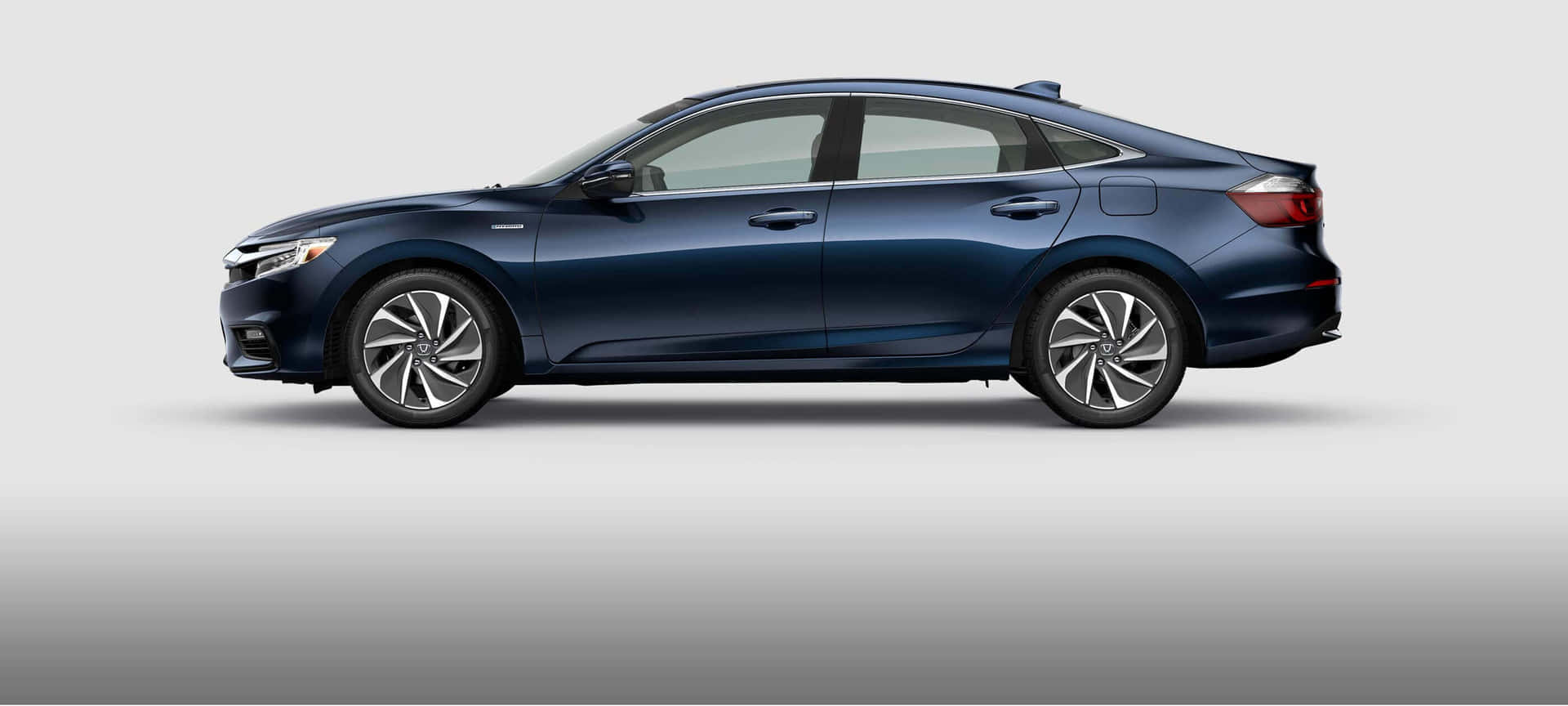 Sleek and Stylish Honda Insight Parked on the Road Wallpaper