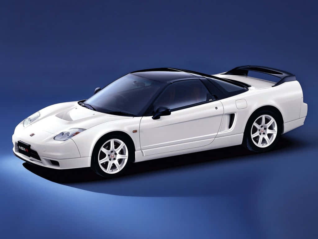 Sleek and Sporty Honda NSX in Action Wallpaper