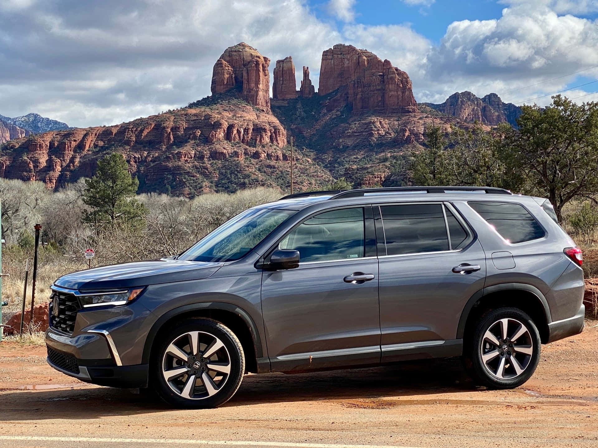 The 2019 Honda Passat Is Parked In Front Of A Red Rock