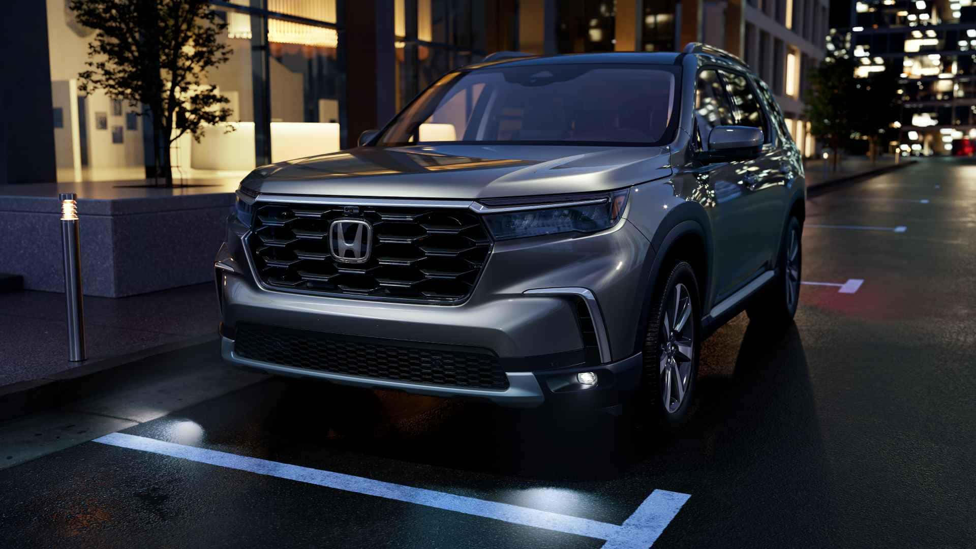 The 2020 Honda Pilot Is Parked In A City At Night