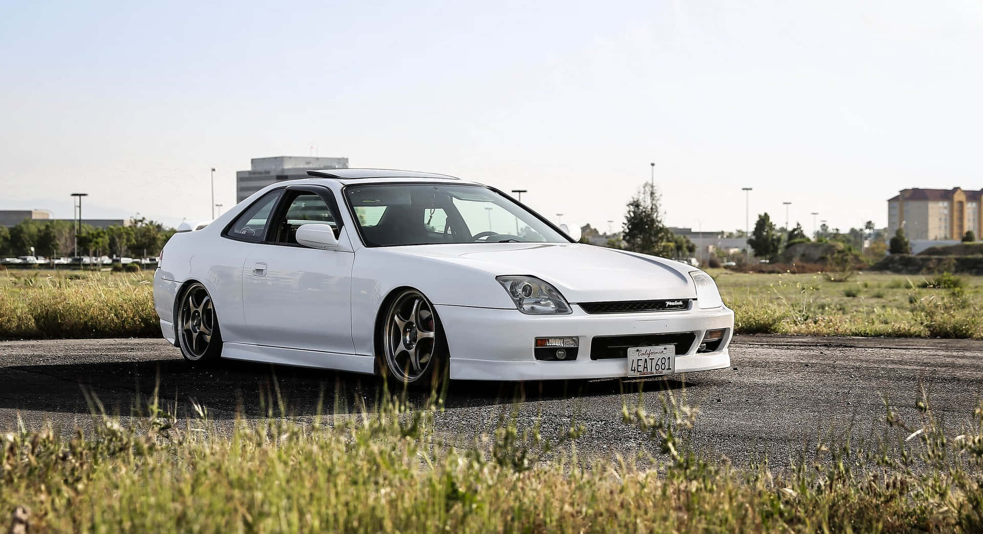 Sleek Honda Prelude in Urban Setting Wallpaper