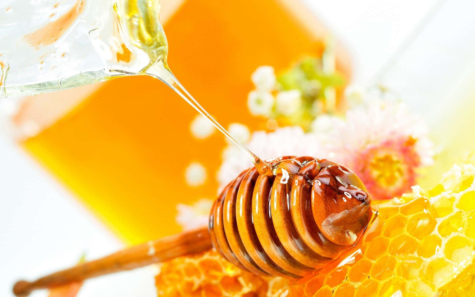 Honey Being Poured Into A Glass