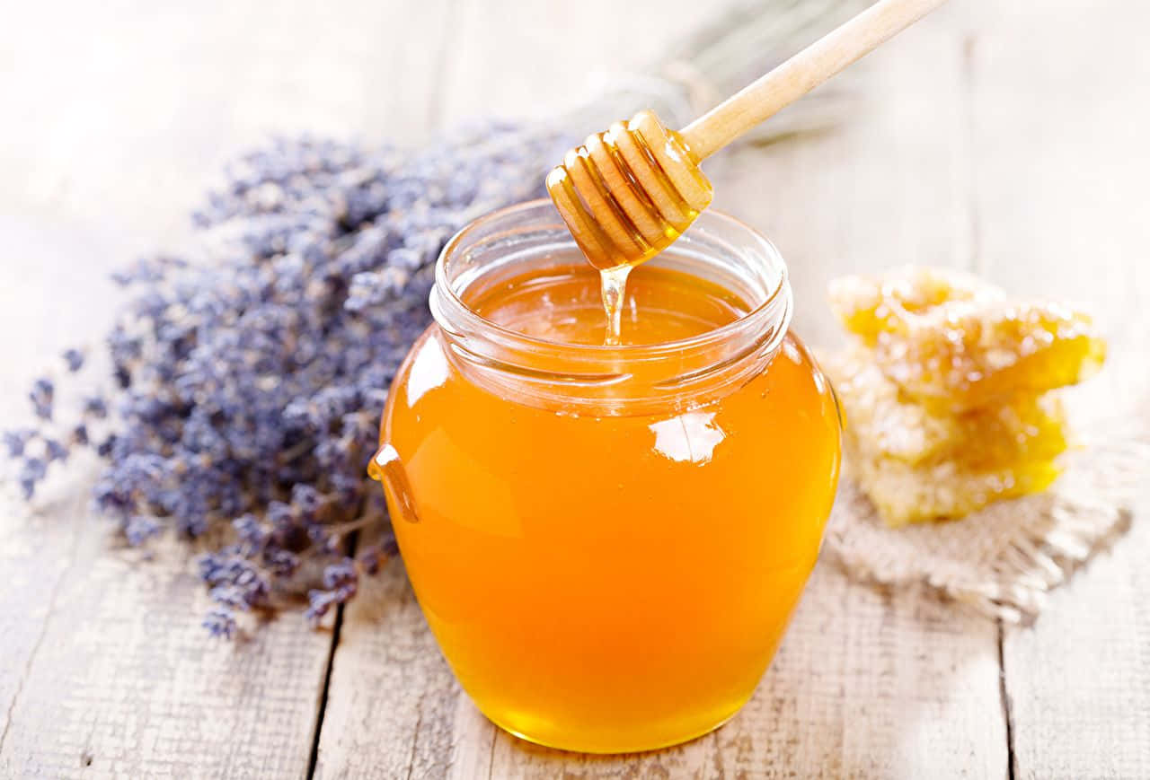 Honey And Lavender On A Wooden Table