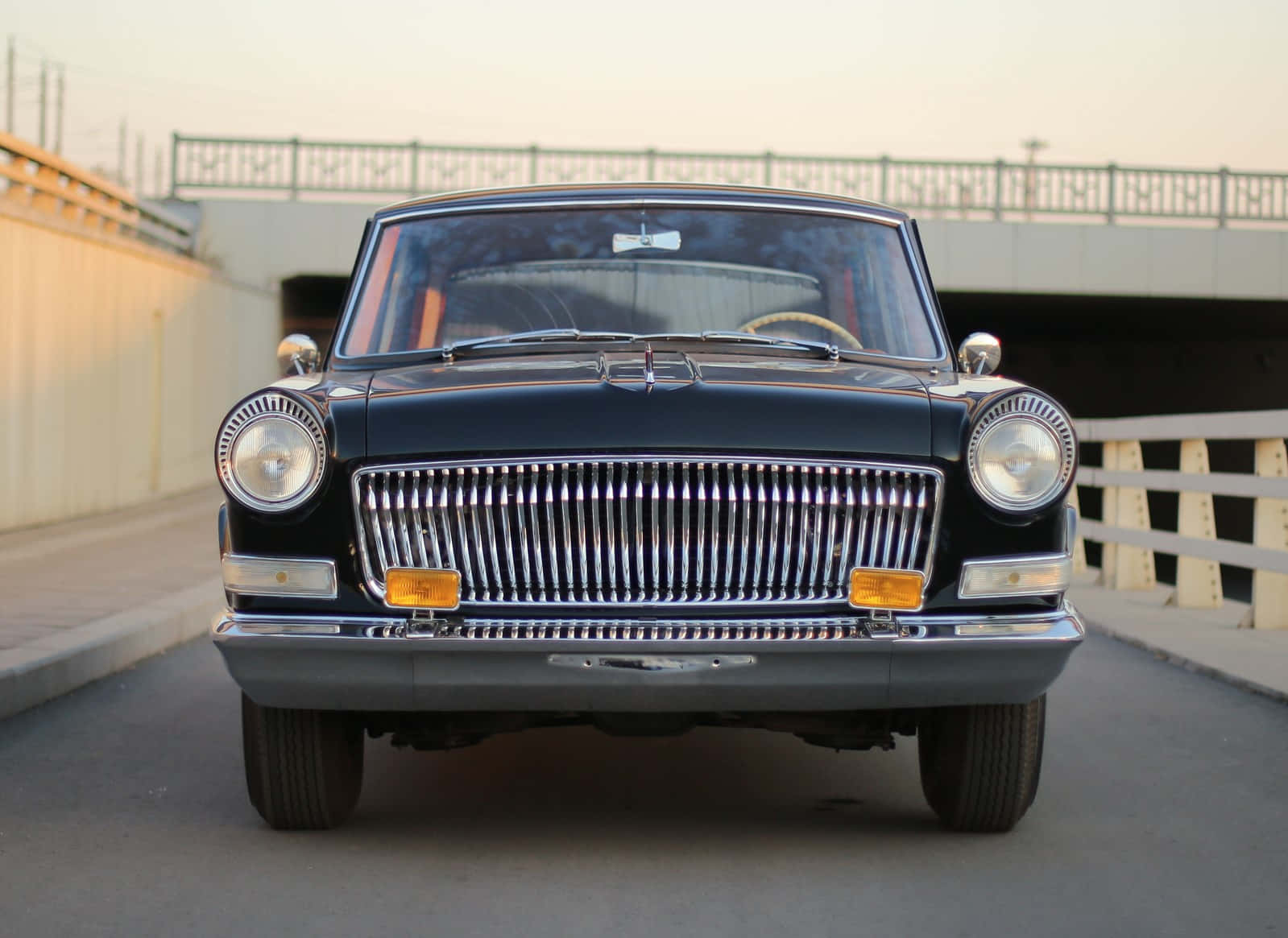 Sleek Red Hongqi Luxury Automobile in a Showroom Wallpaper