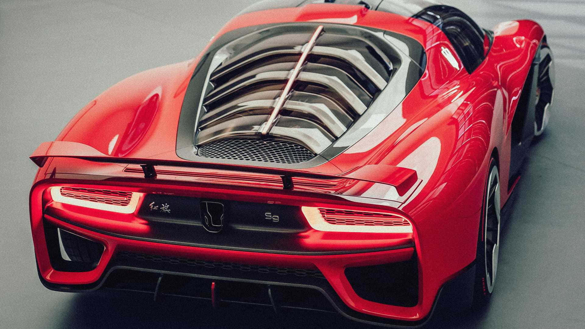 Sleek Red Hongqi Luxury Car on the Open Road Wallpaper