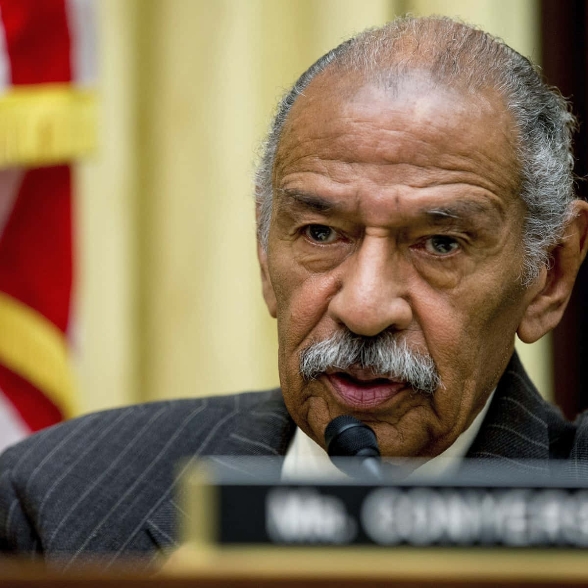 Honorable John Conyers In A Blue Tie And Gray Suit Wallpaper