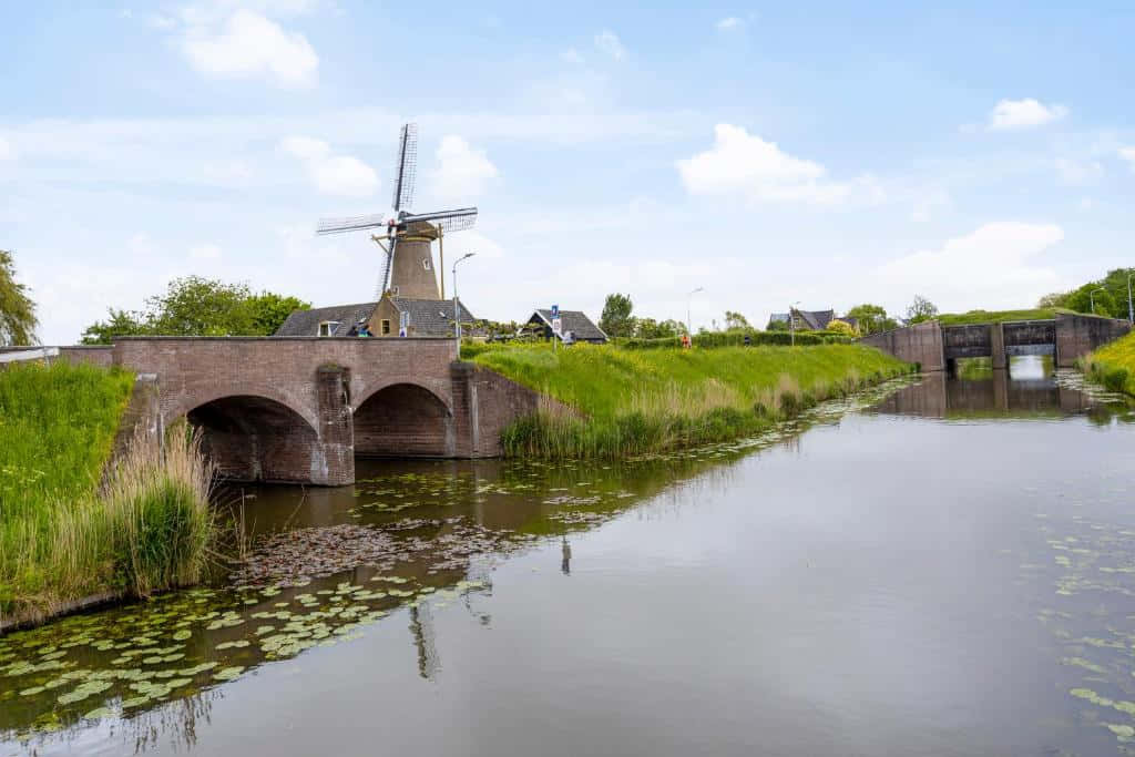 Hoofddorp Dutch Windmill Over Water Wallpaper