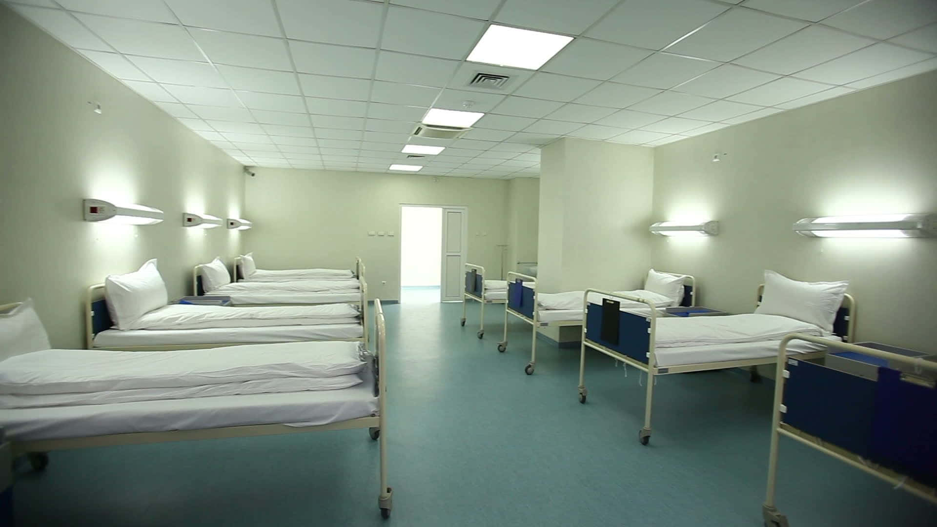 A Row Of Beds In A Hospital Room