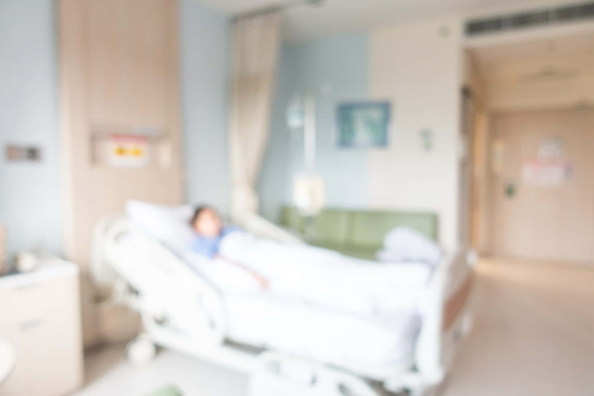 A Blurry Image Of A Hospital Room