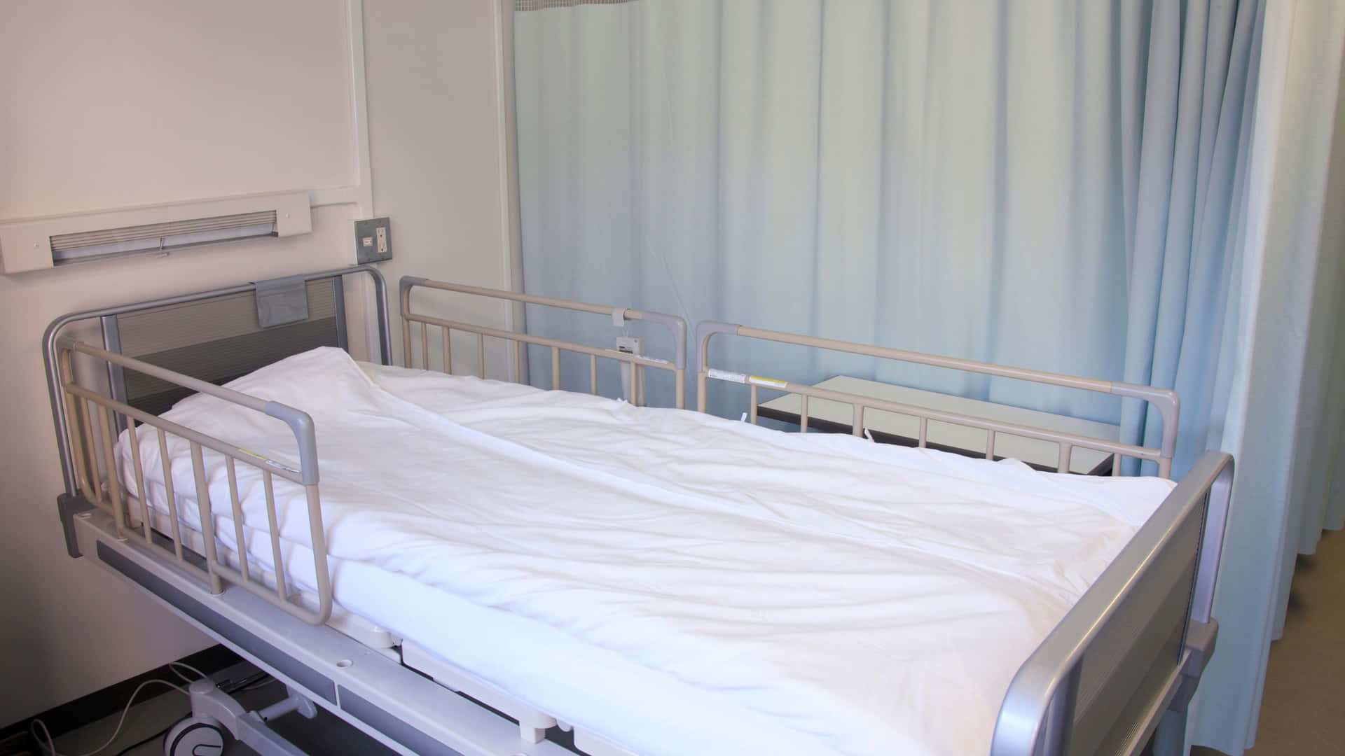 A Hospital Bed In A Room