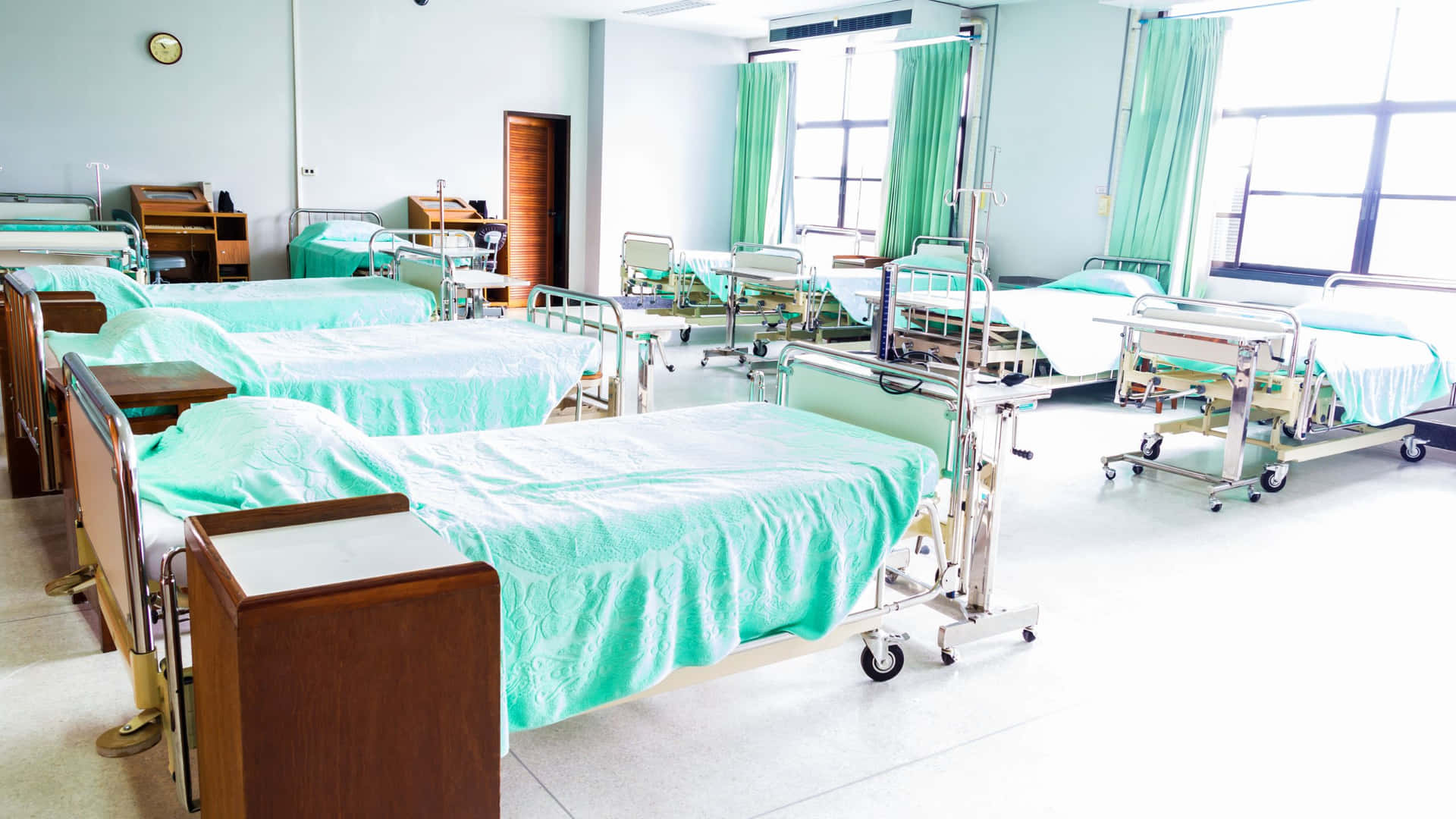 A Hospital Room With Many Beds