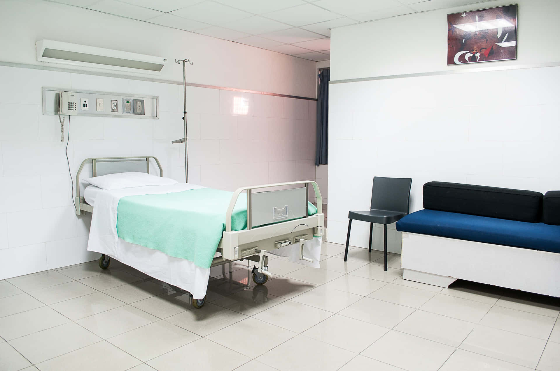 Modern Hospital Bed in a Well-Lit, White Room Wallpaper