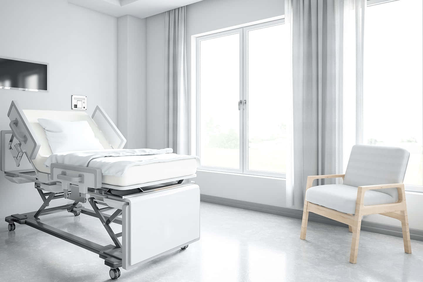 A Hospital Room With A Bed And Chair