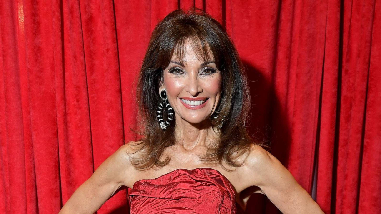 Host Susan Lucci In Red Background
