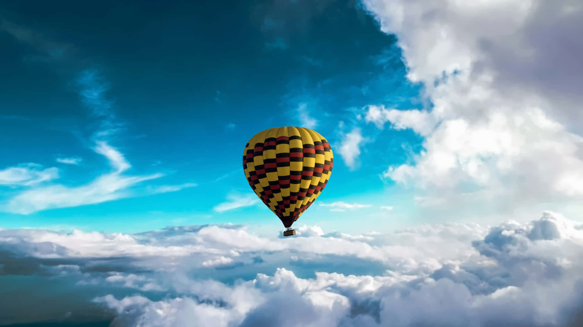 A Hot Air Balloon Flying Above The Clouds