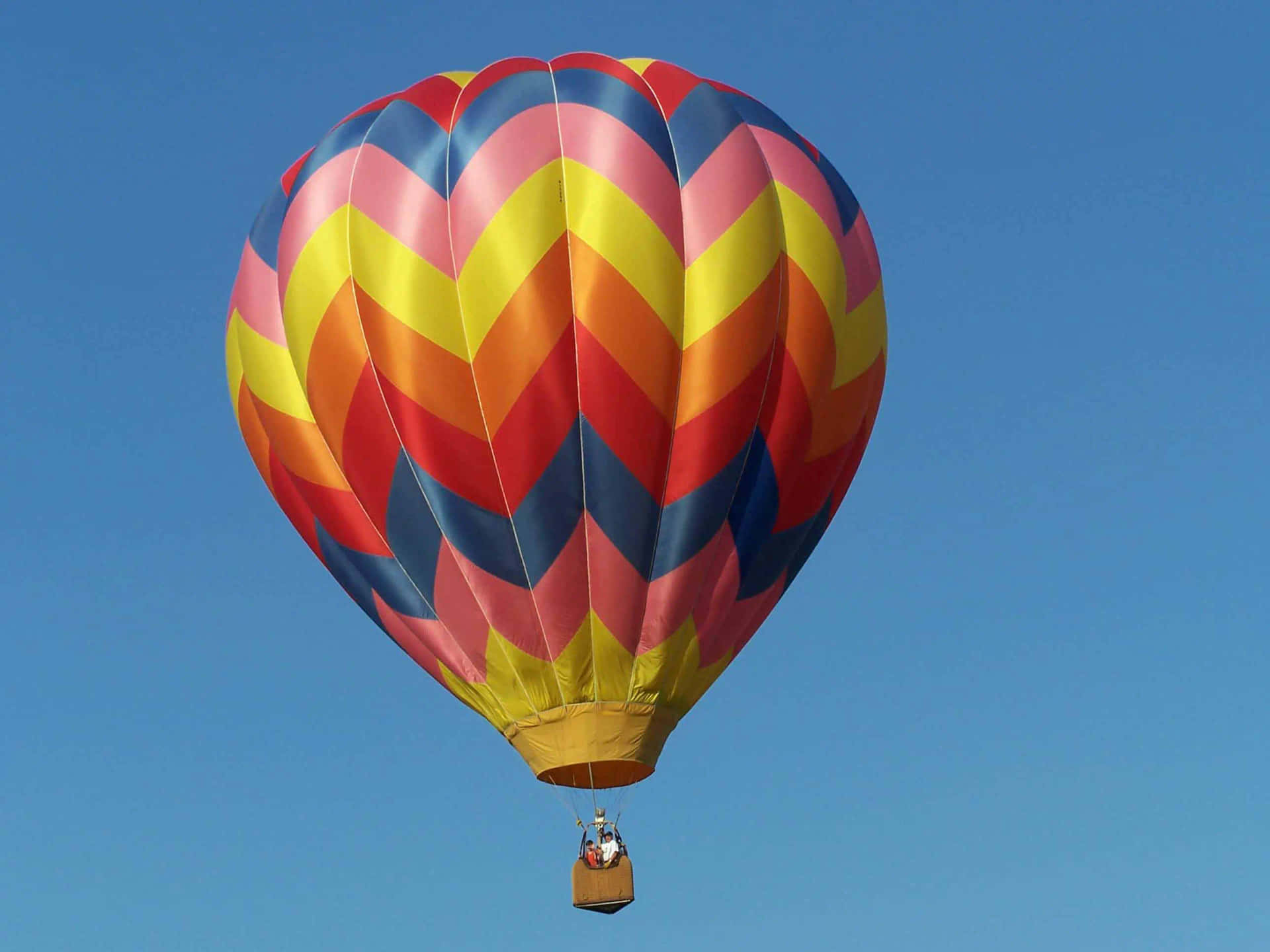 Soaring Through The Clouds in a Brightly Colored Hot Air Balloon