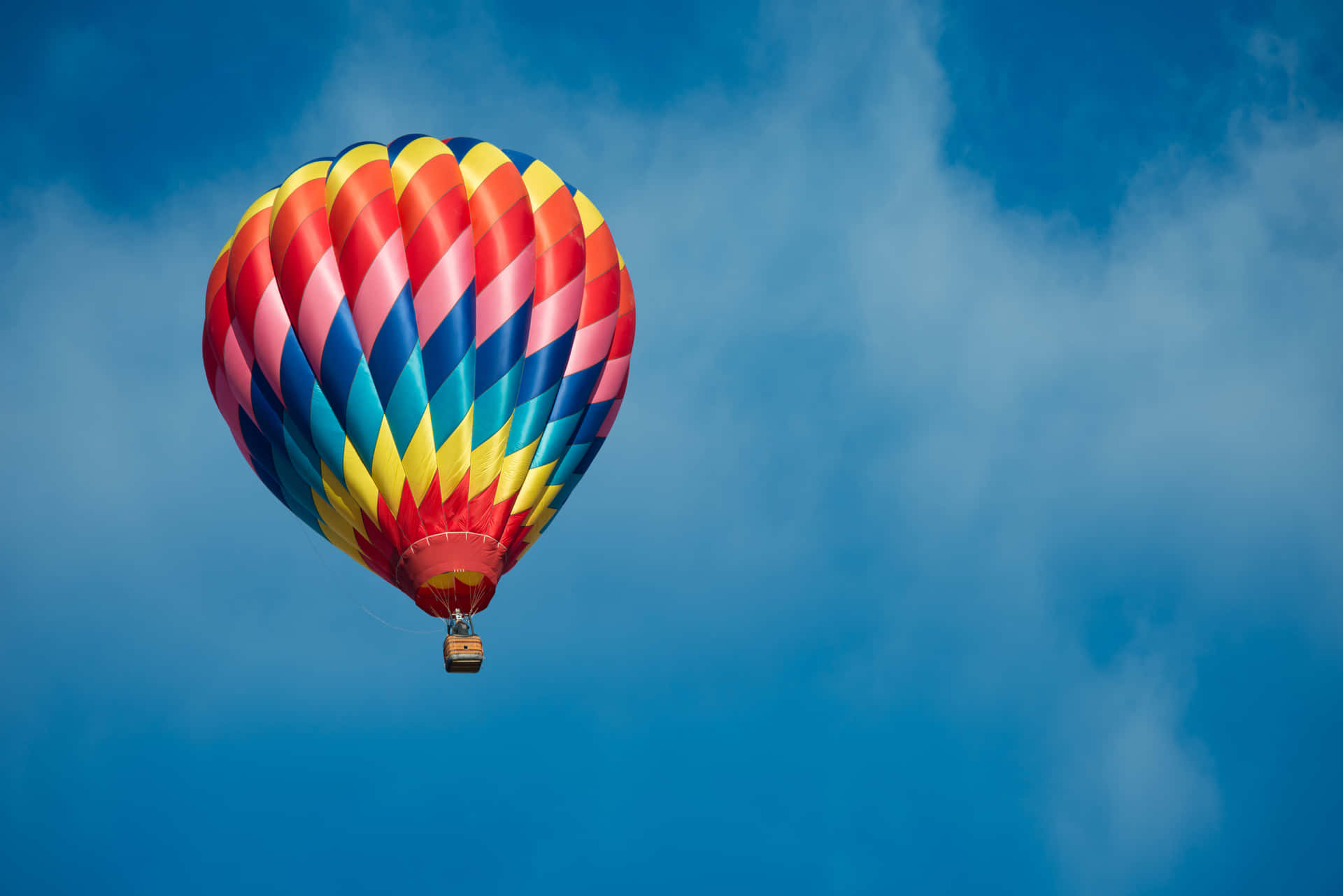 "Experience the magic of flight with a colorful hot air balloon!"
