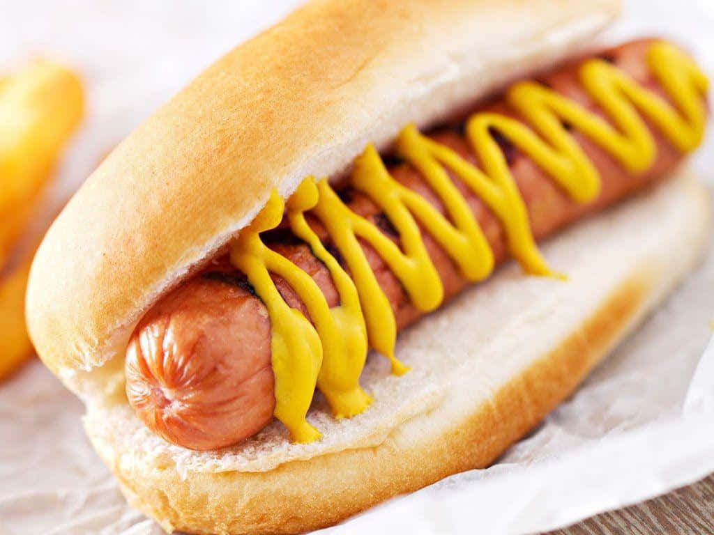 A Hot Dog With Mustard And Mustard