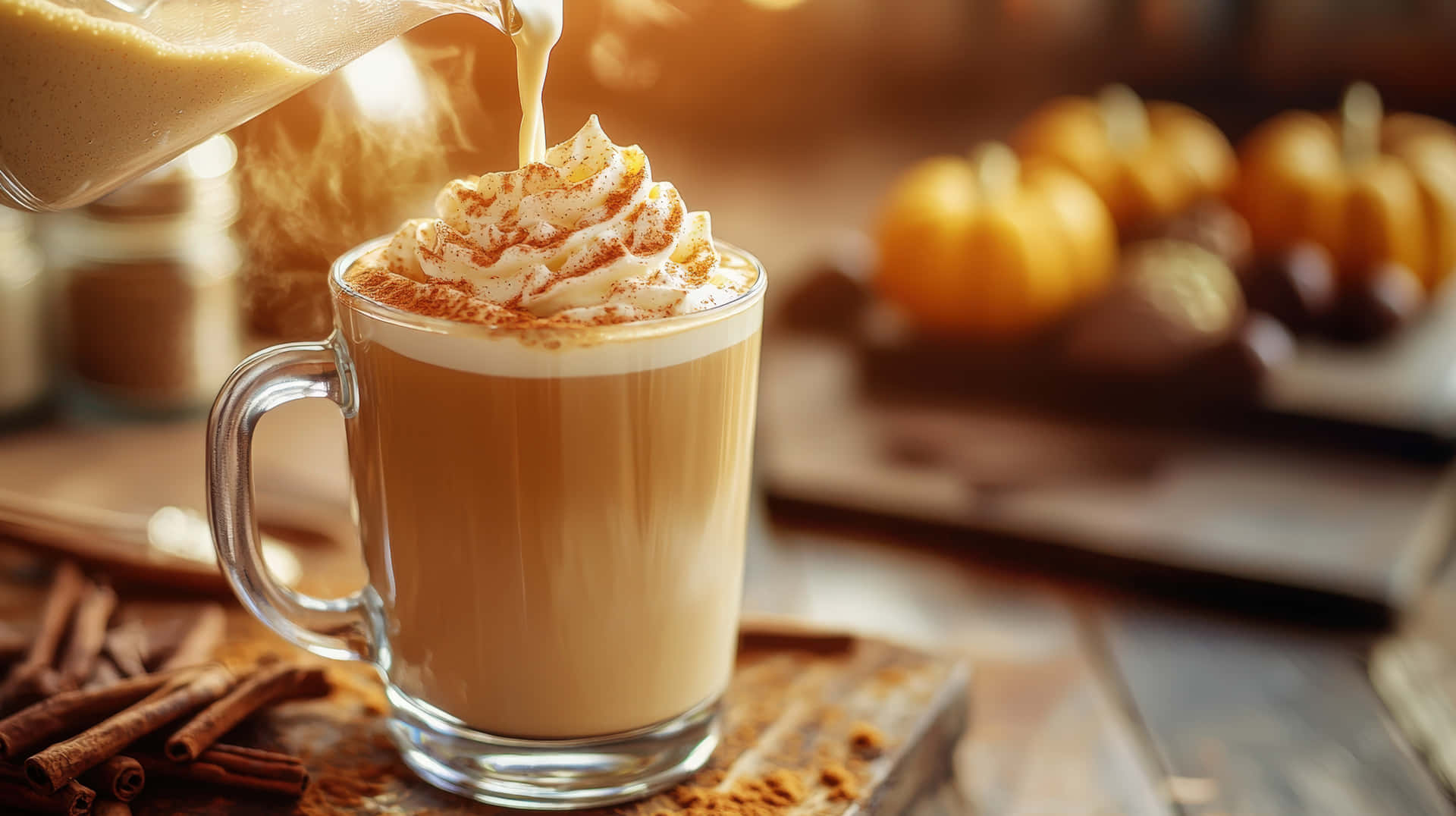 Hot Pumpkin Spice Latte With Whipped Cream And Cinnamon In A Cozy Autumn Setting Wallpaper