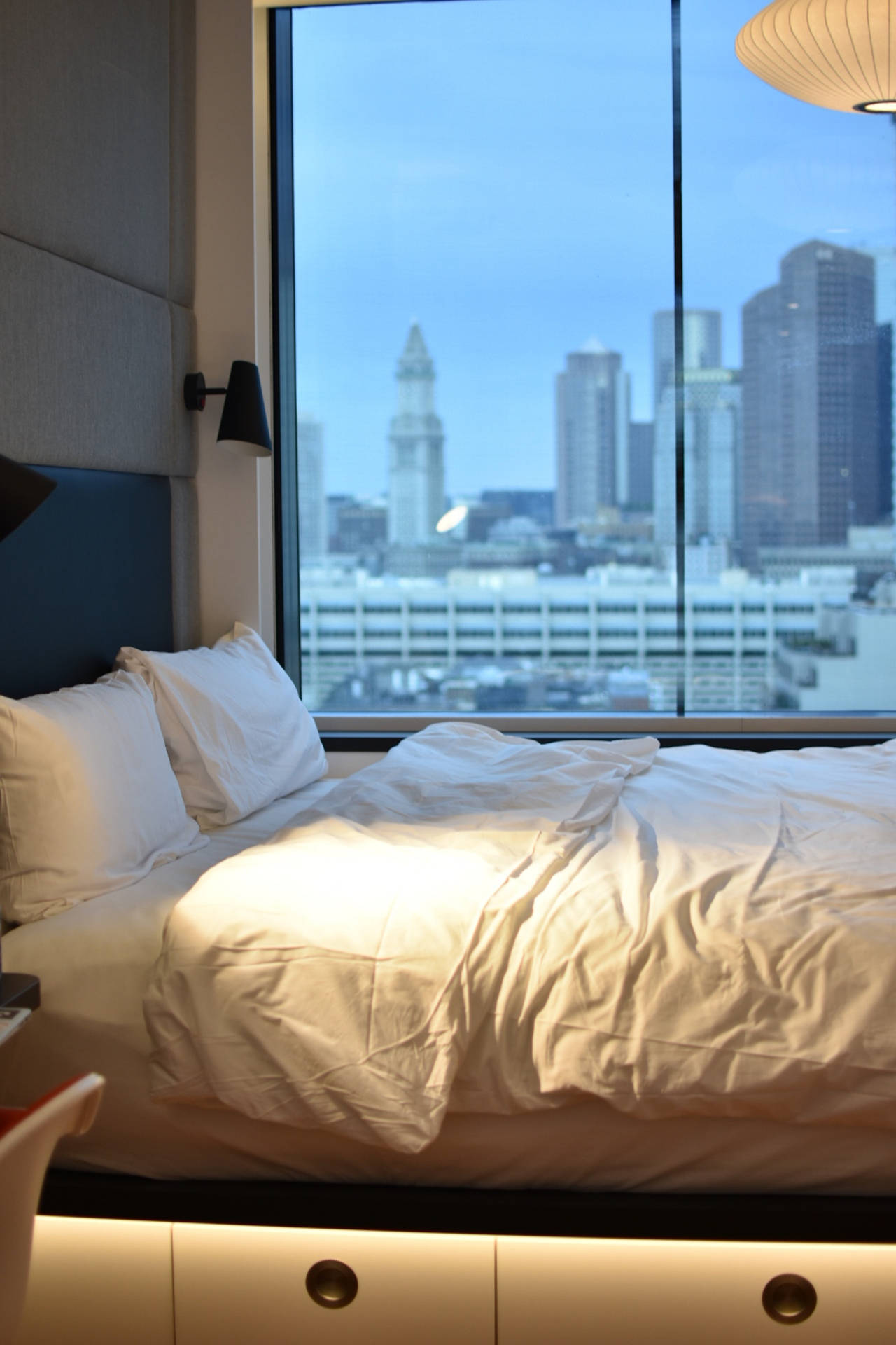 Hotel Bedroom With City View Wallpaper