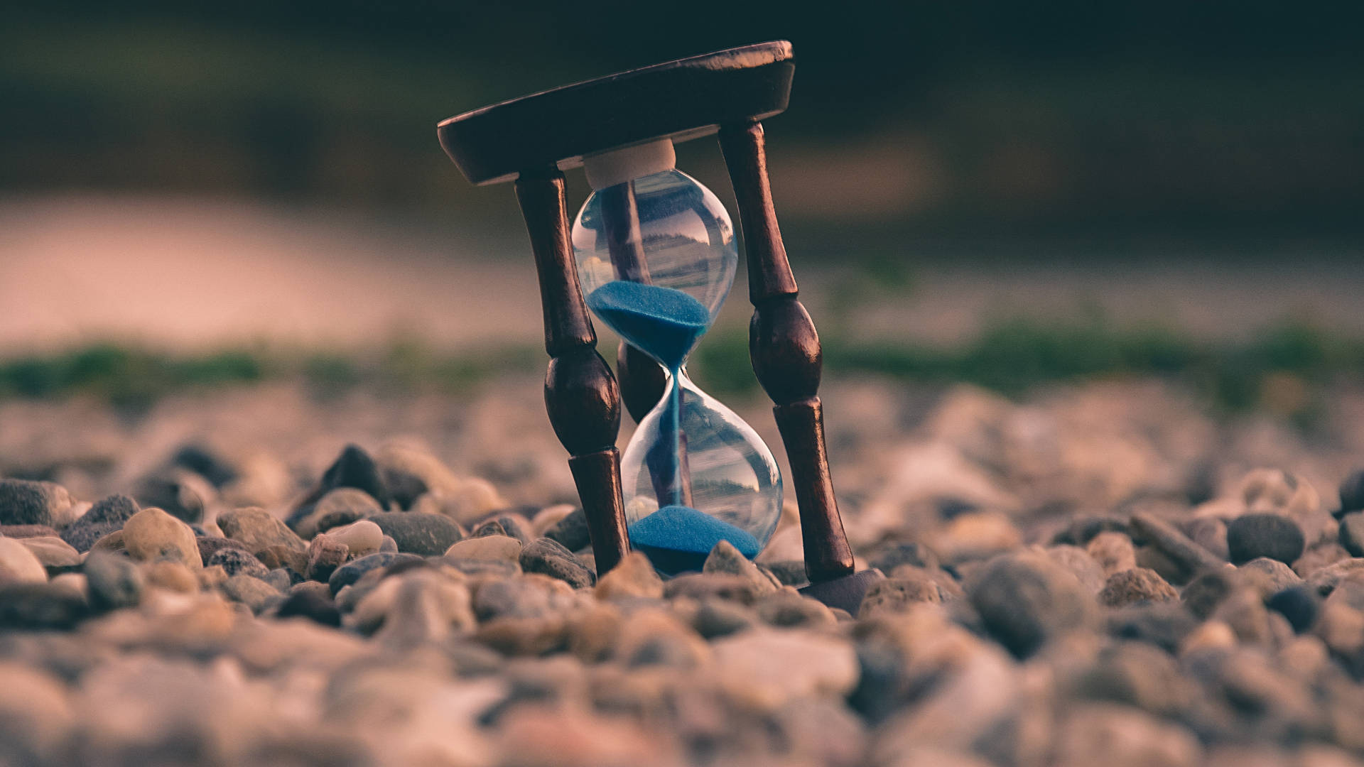 Hourglass On Rocks Tiempo Background Wallpaper