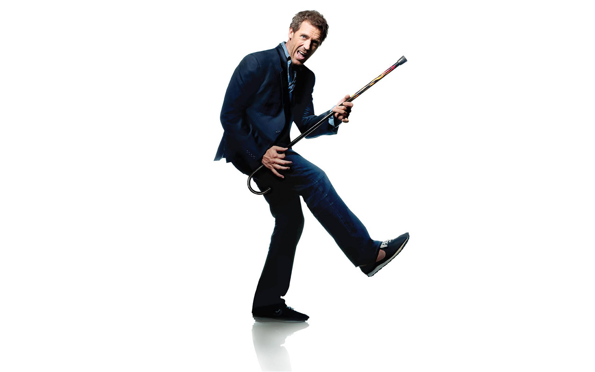 Iconic Dr. House with His Signature Cane and Guitar Wallpaper