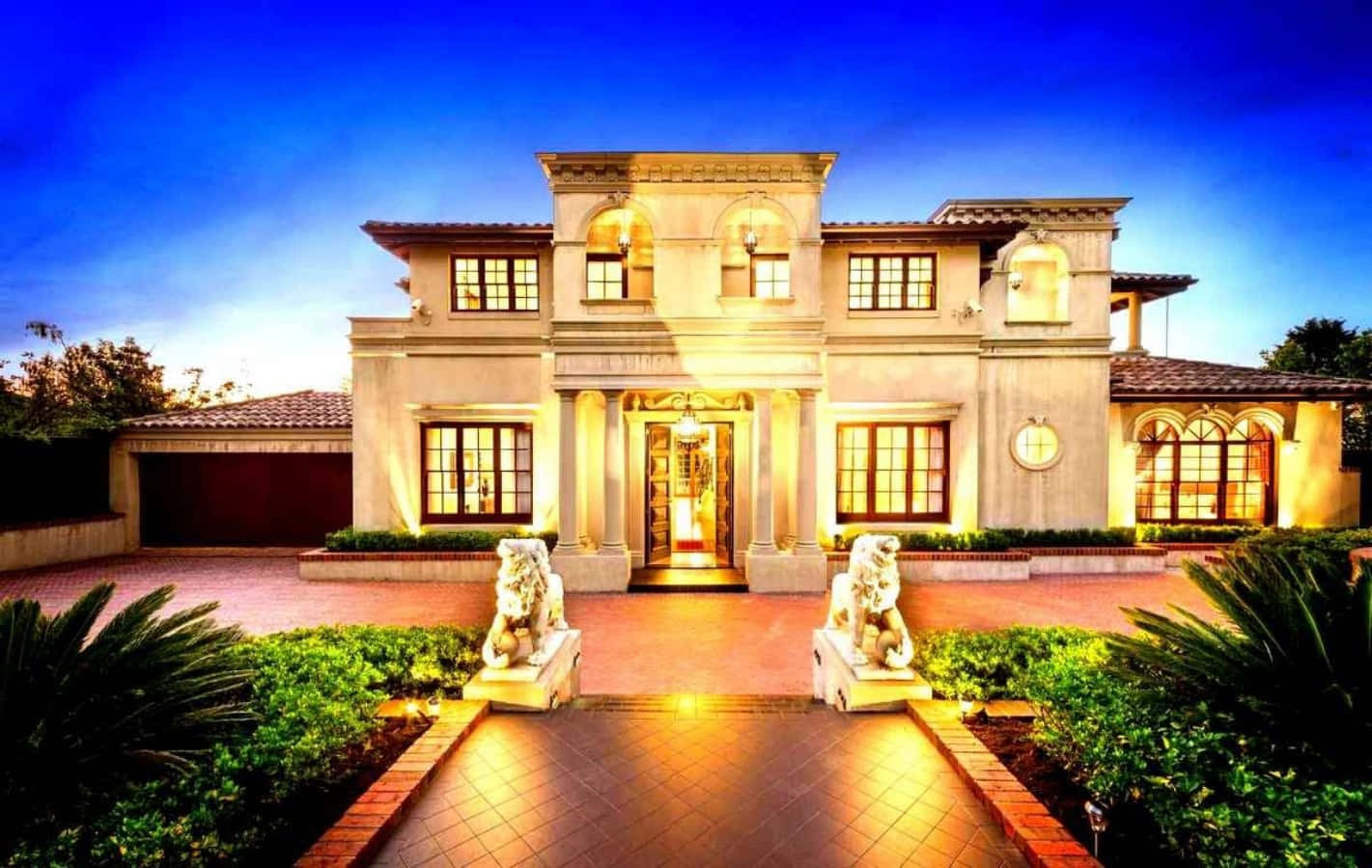 A Large Mansion With A Large Driveway