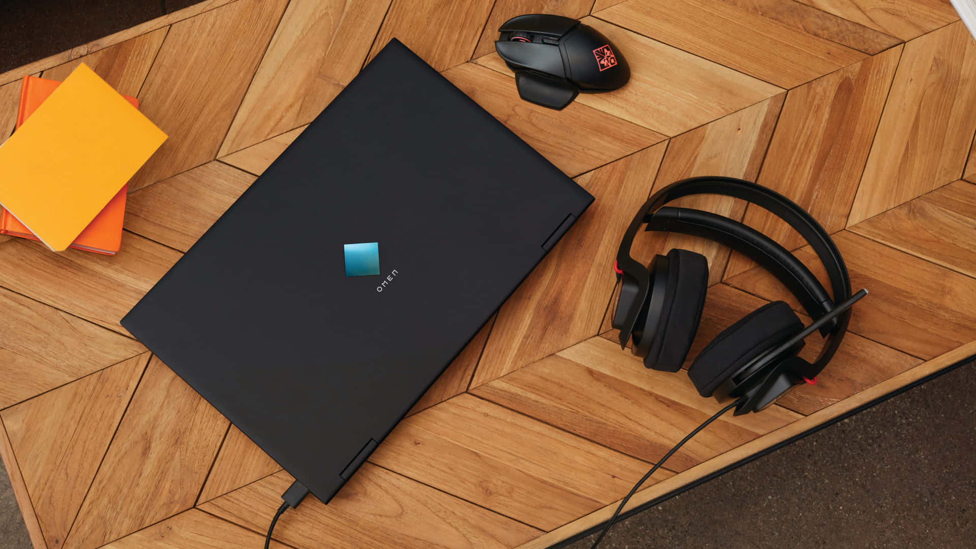 A Laptop, Headphones, And A Mouse On A Wooden Table Wallpaper