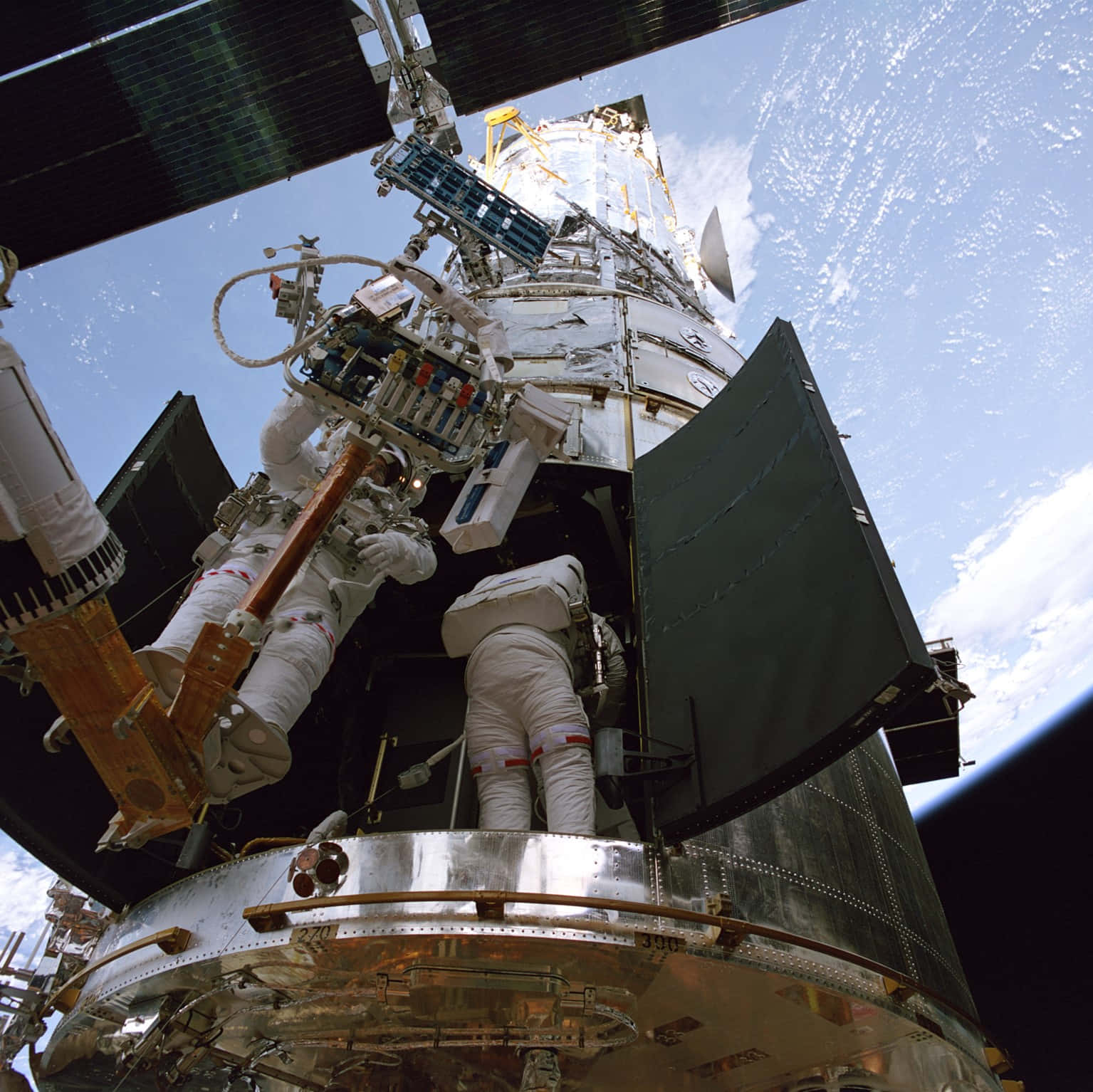 Astronauts Working On Hubble Pictures